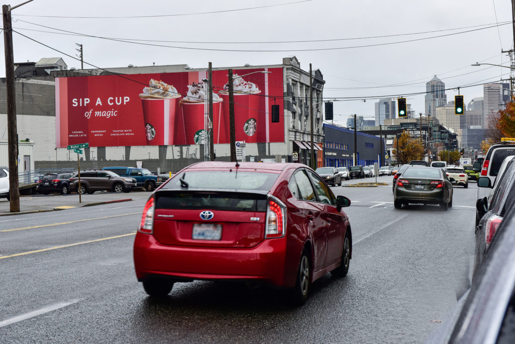 Large wallscape advertisement located in Seattle, Washington.